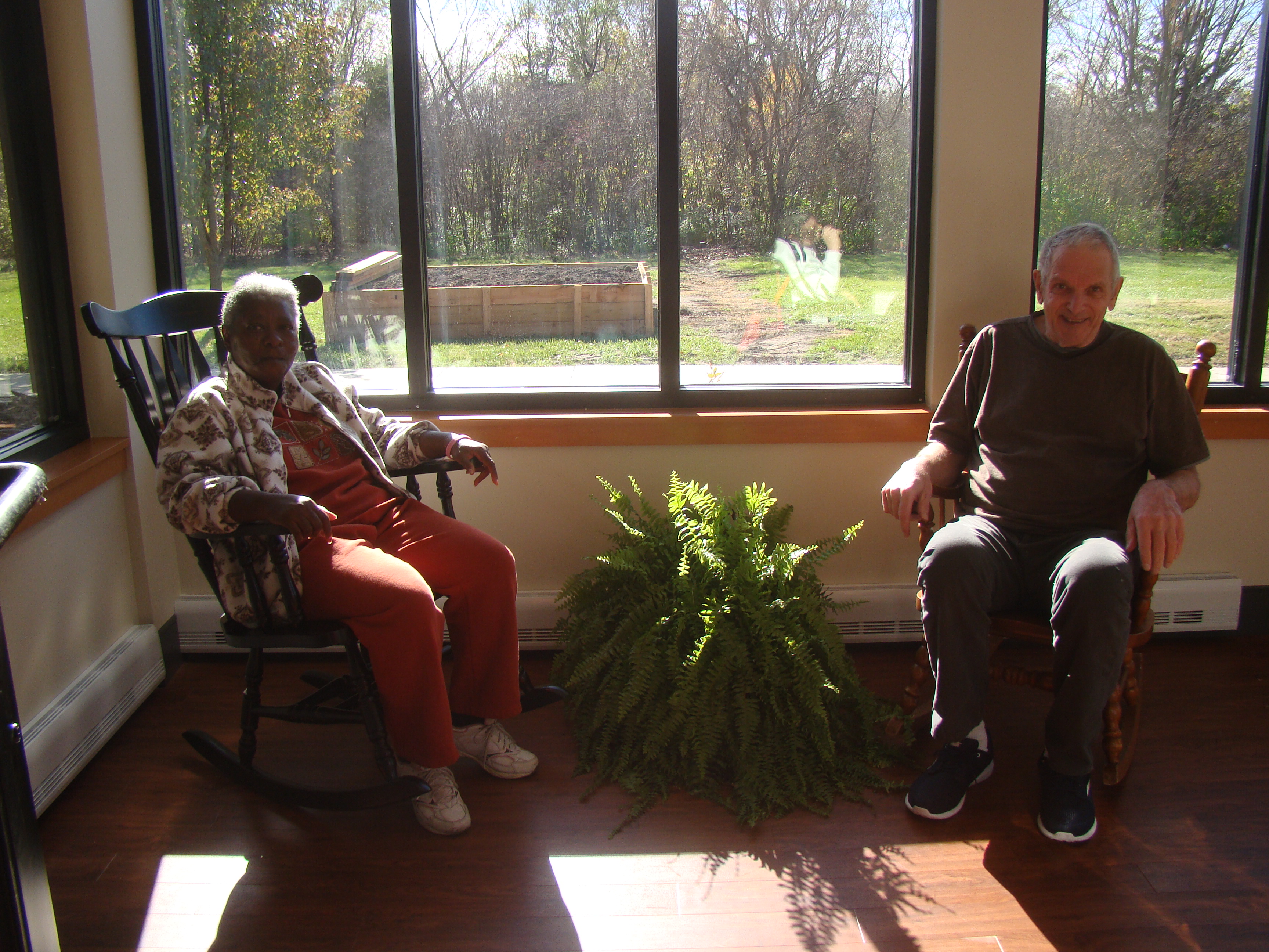 TARC's Day Services Participants enjoying the new sunroom in the Virginia Geers Building